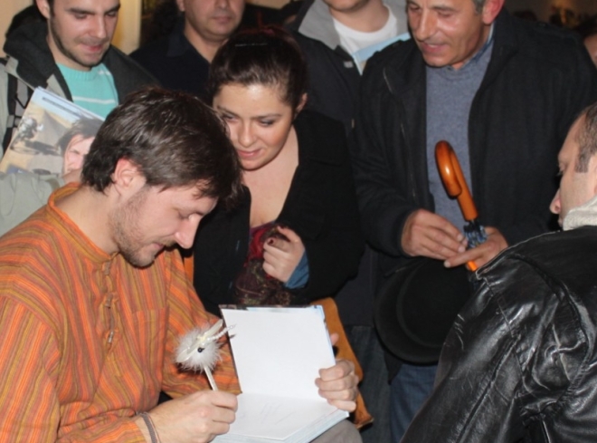 Mihai signing books romanian men riders romanians